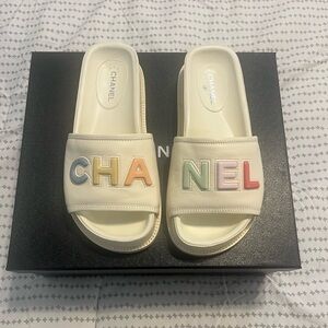 CHANEL 22S Lambskin Signature Logo Letters Mules Sandals